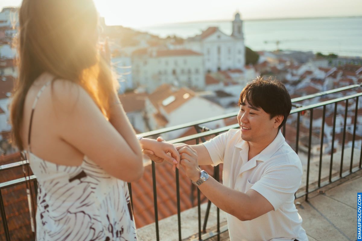 Lisbon proposal! Couple engaged with Alfama view. Romantic moment in Portugal.