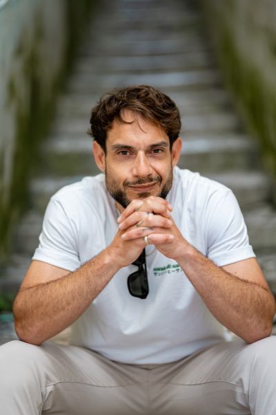 Man on steps in Lisbon. Portrait of a bearded man with a nose ring, sitting on stone steps in Lisbon, Portugal.