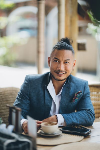 Man in Lisbon cafe. Stylish man in blazer enjoys coffee. Lisbon vibes.
